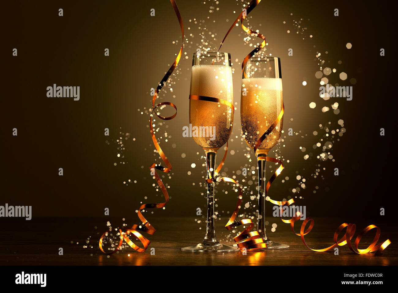 Two champagne glasses ready to bring in the New Year Stock Photo - Alamy