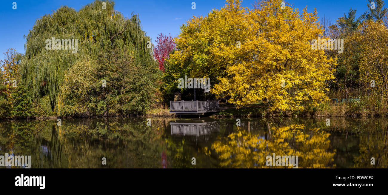 Lake with colorful reflections of trees Stock Photo