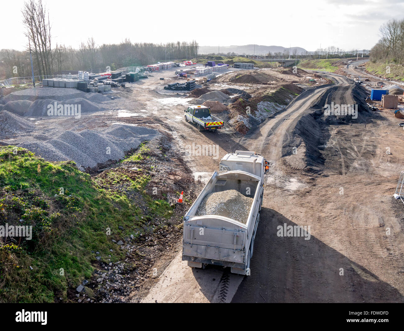 Lorry arriving on site to unload stone for a new road layout Stock Photo