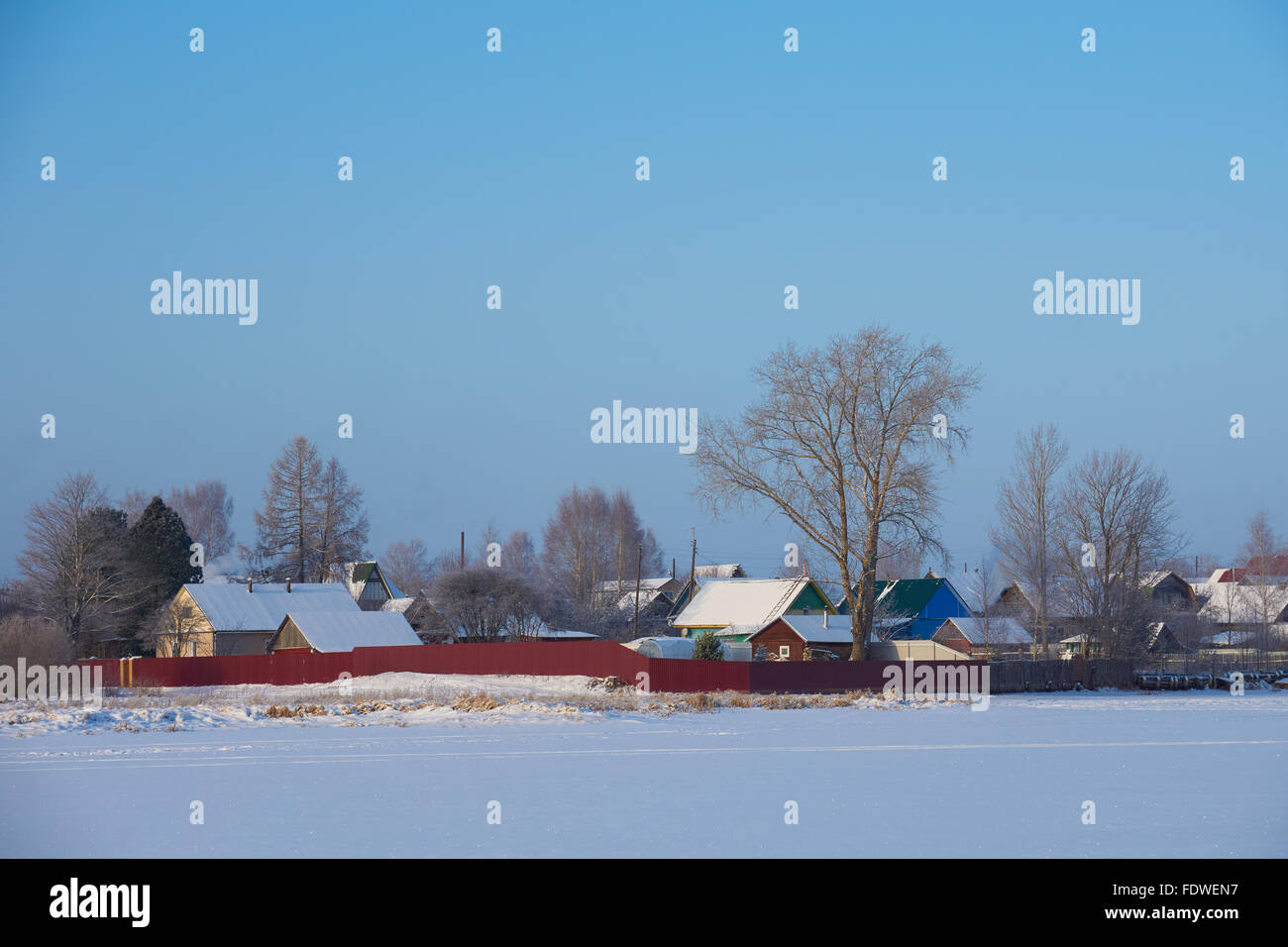 View on russian village in winter from lake. Peno, Tver region, Russia Stock Photo