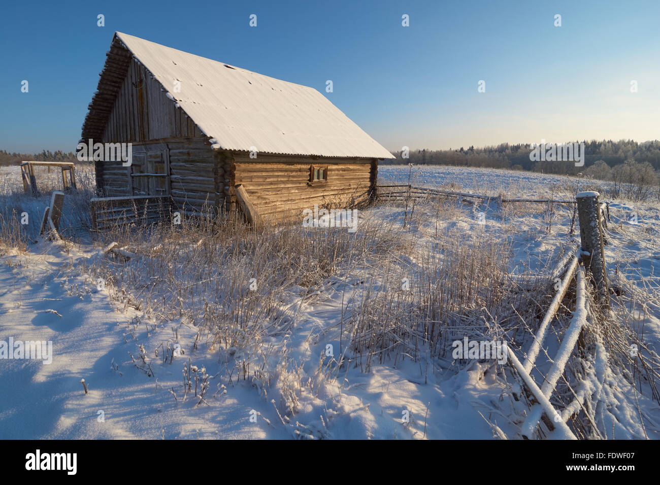 Old Wooden Log Barn Surrounded By A Fence Stock Photo, Picture and Royalty  Free Image. Image 19959936.