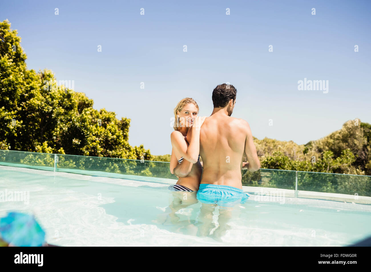 Couple Relaxing In A Swimming Pool Stock Photo - Download Image Now -  Anniversary, Beach, Blue - iStock