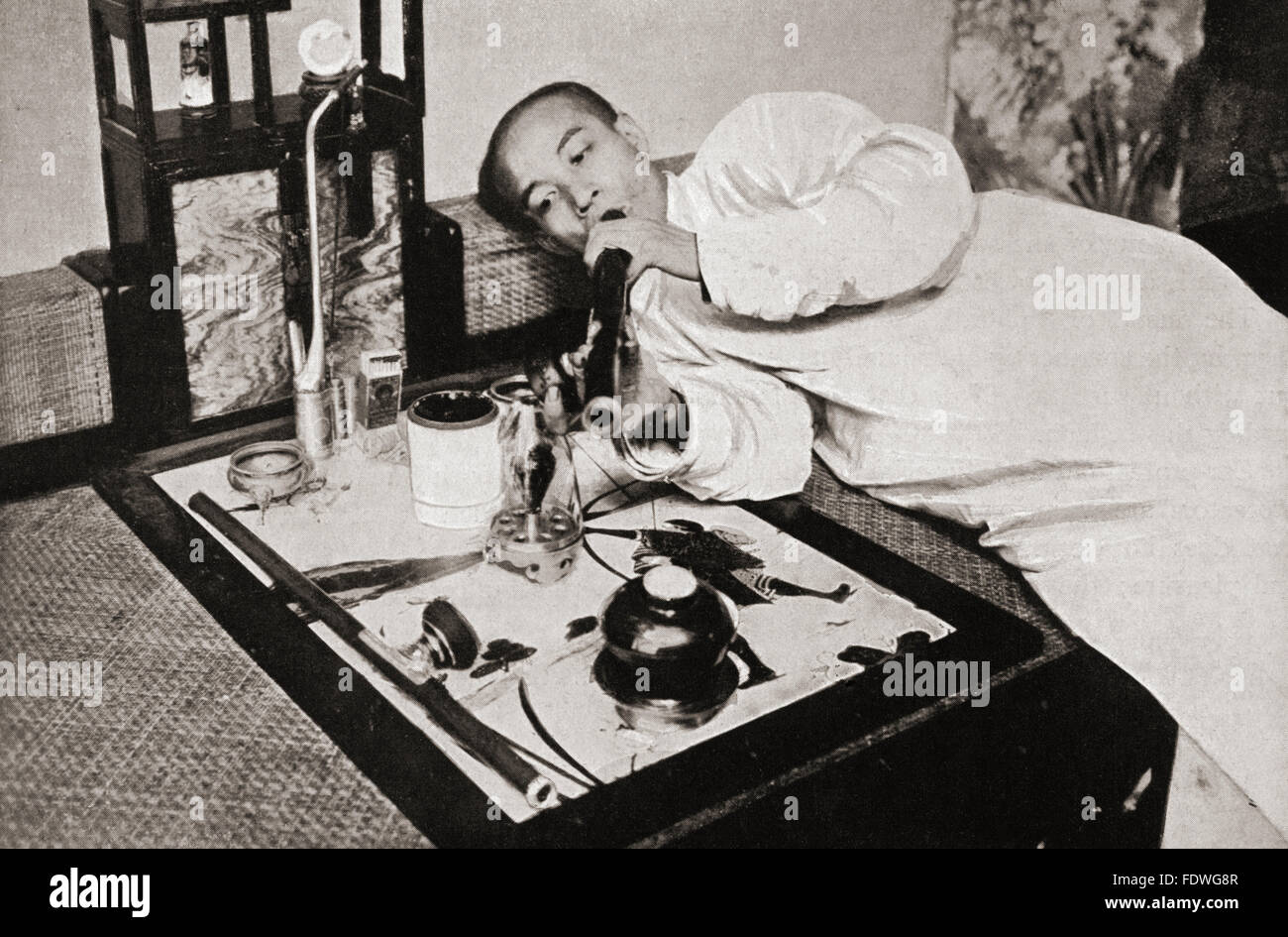 Opium smoking in China in the 19th century.  After a 19th century photograph. Stock Photo