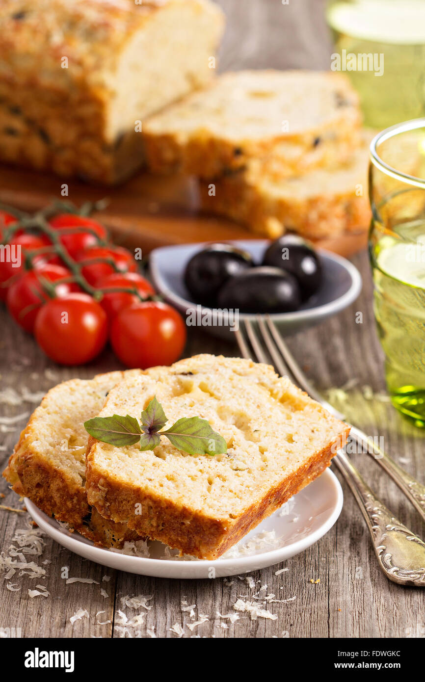 Savoury loaf cake with tomatoes, cheese and olives Stock Photo