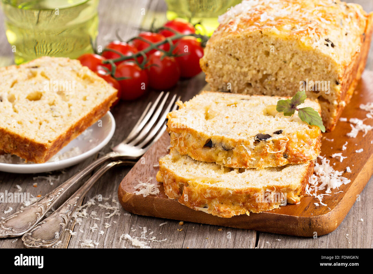 Savoury loaf cake with tomatoes, cheese and olives Stock Photo