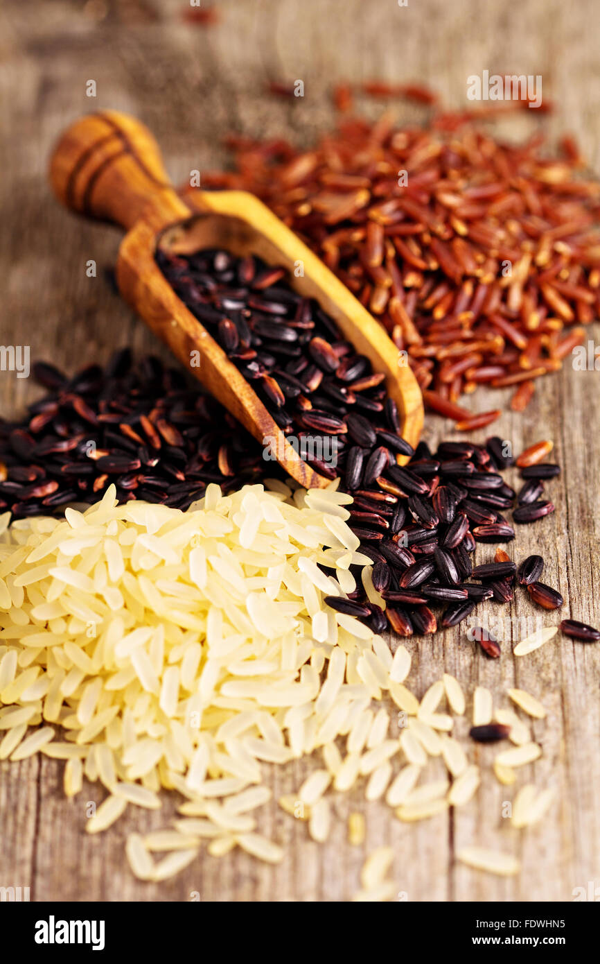Variety of rice on a wooden background Stock Photo - Alamy