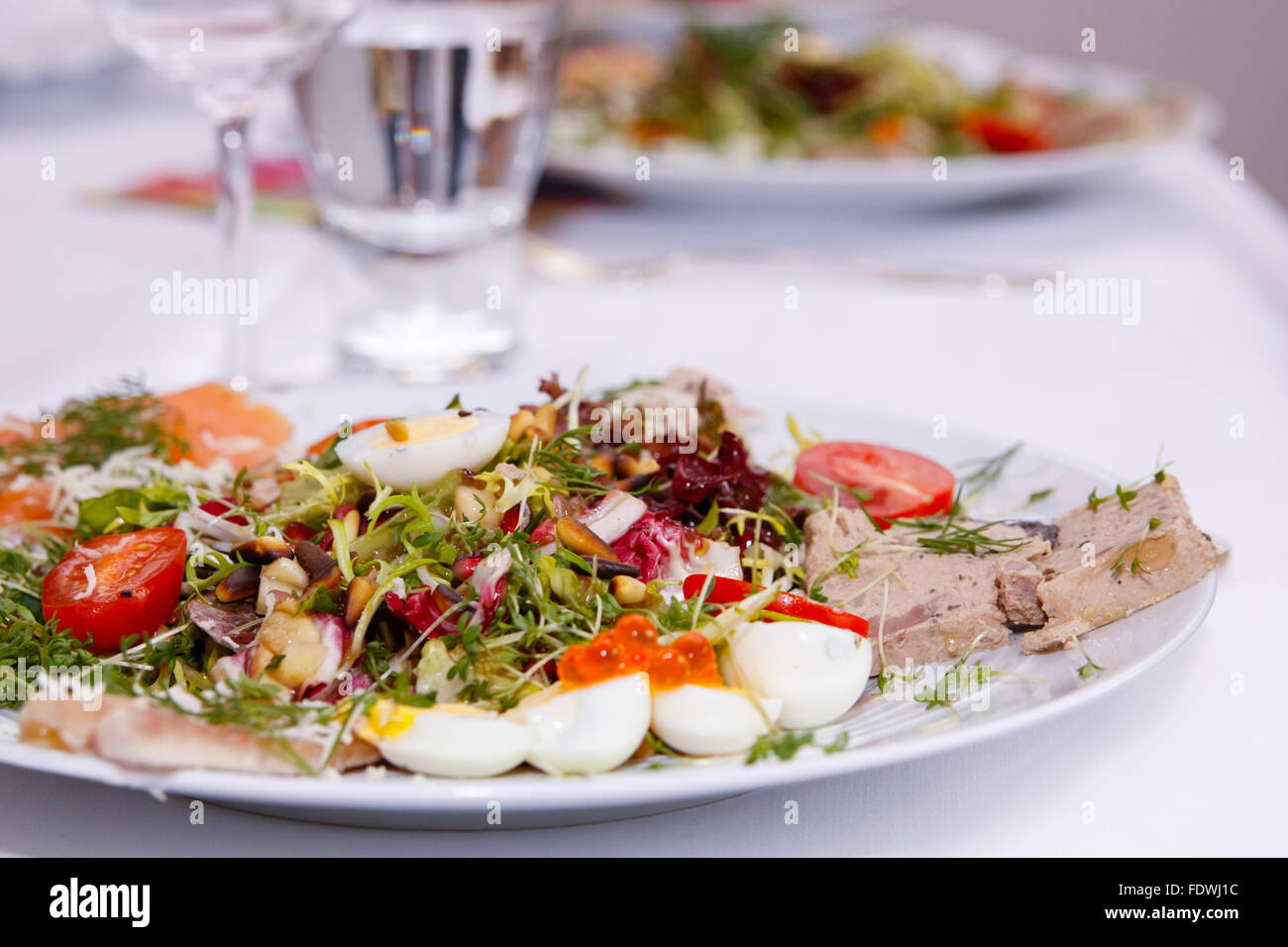 gourmet summer salad with foie gras and quail eggs Stock Photo