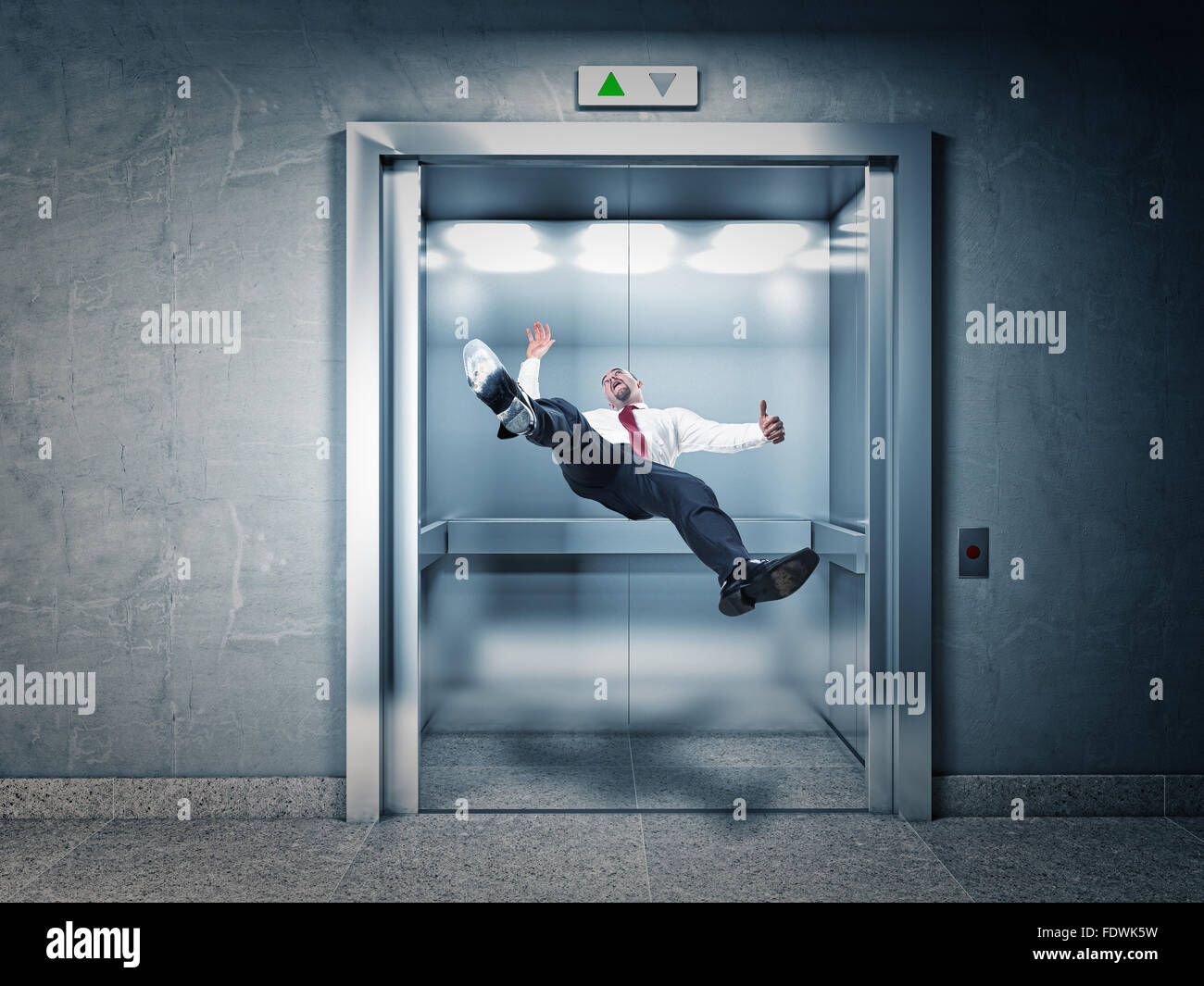 businessman falling in modern elevator Stock Photo