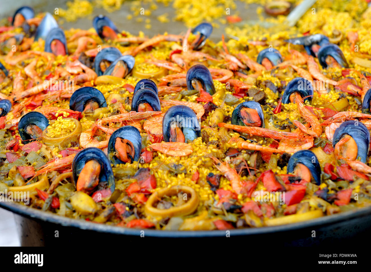 SEAFOOD PAELLA IN AN OUTDOOR RESTAURANT IN ALICANTE SPAIN Stock Photo