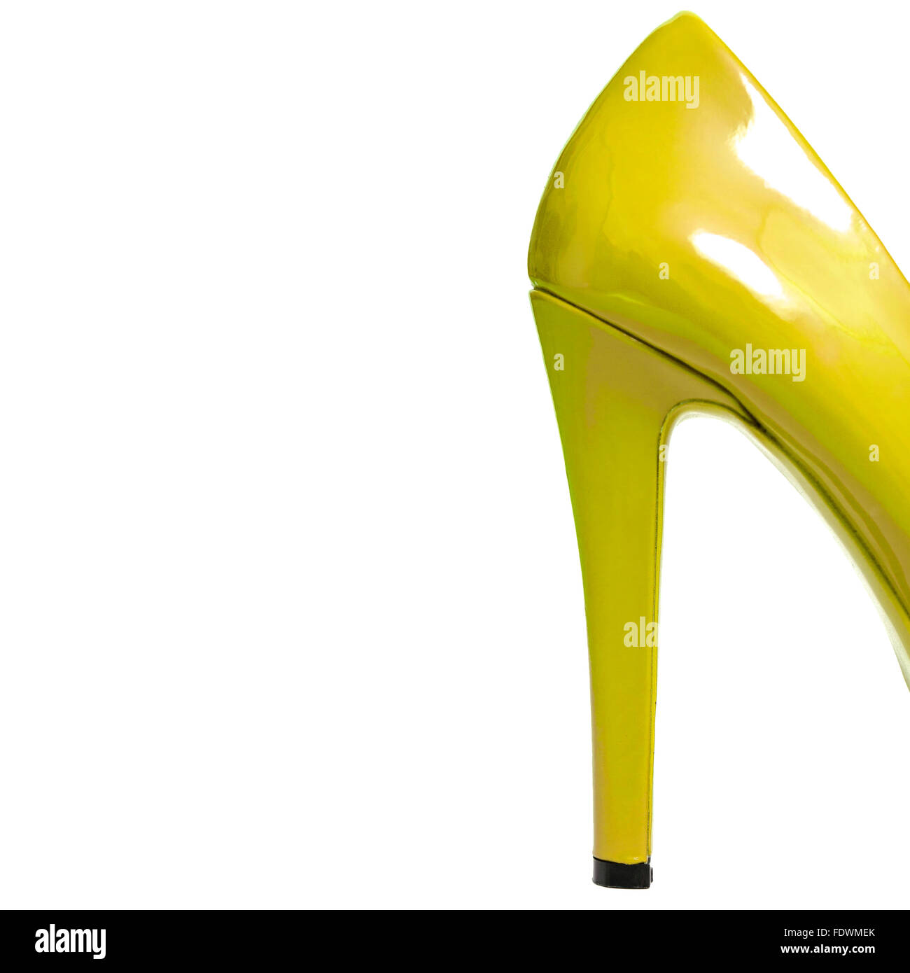 Back of yellow shiny patent leather high heels isolated on white