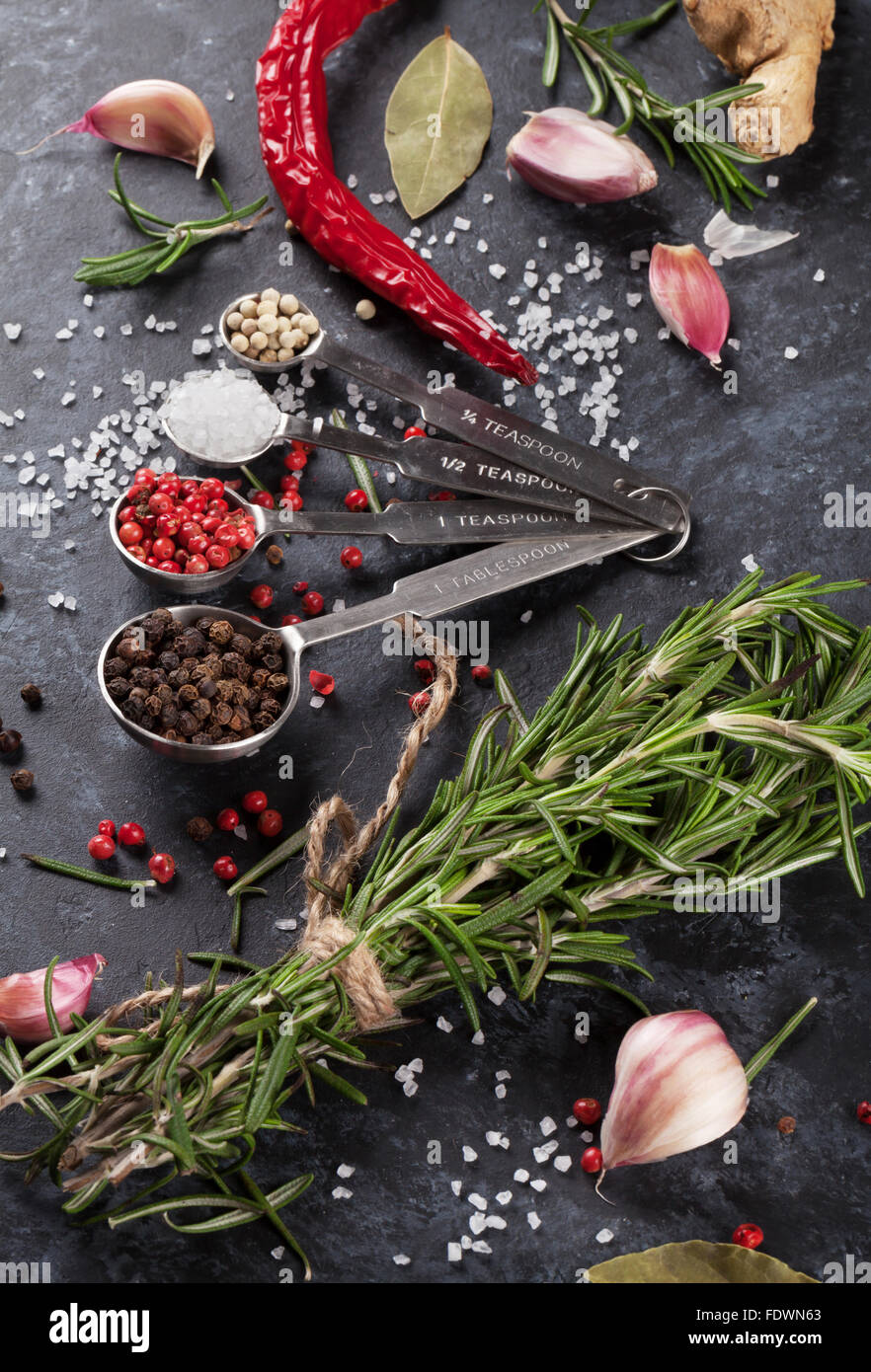 Herbs and spices over black stone background Stock Photo