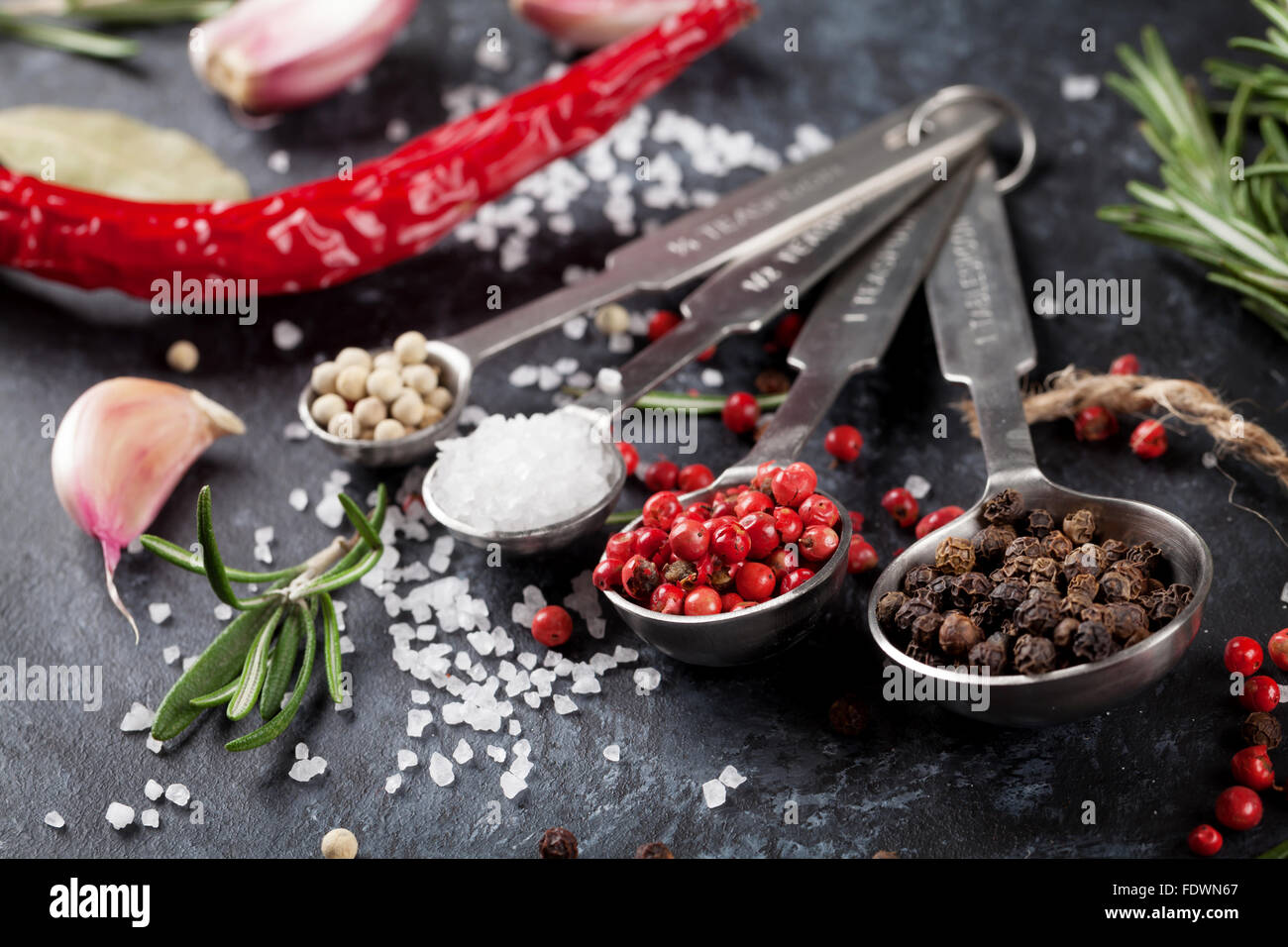 Herbs and spices over black stone background Stock Photo