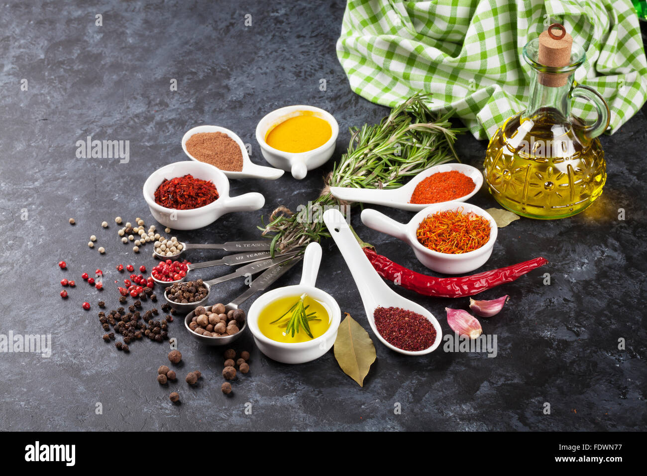Herbs and spices on stone table Stock Photo