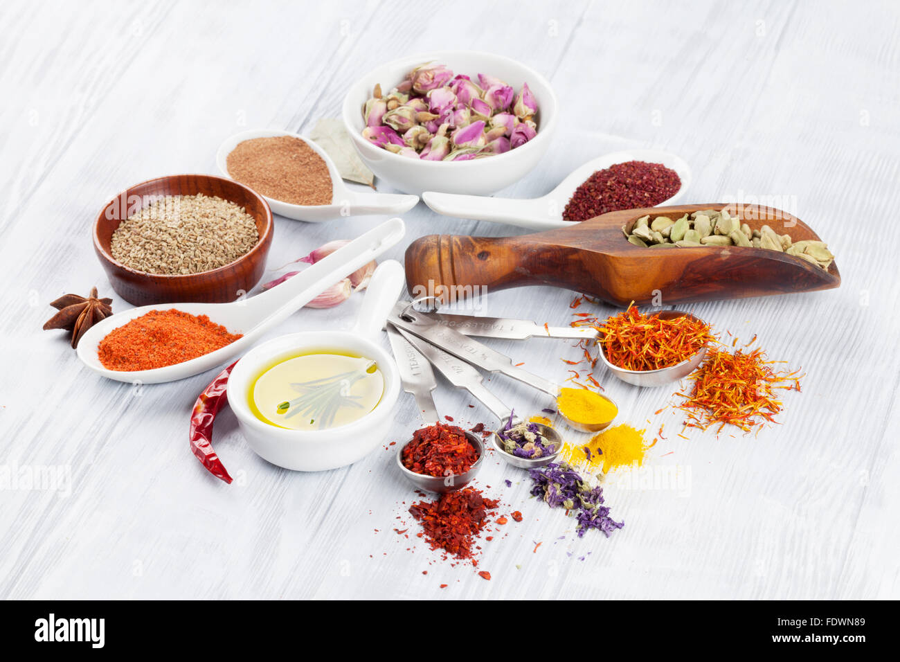 Herbs and spices over white wood background Stock Photo