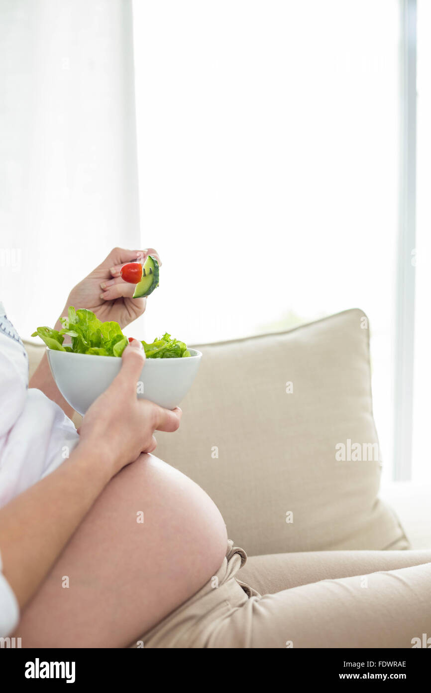 Pregnant woman eating salad Stock Photo Alamy