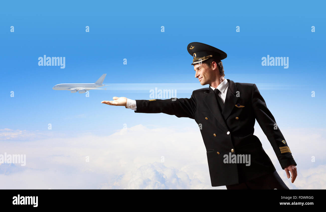 Image of pilot touching sky against airplane background Stock Photo - Alamy