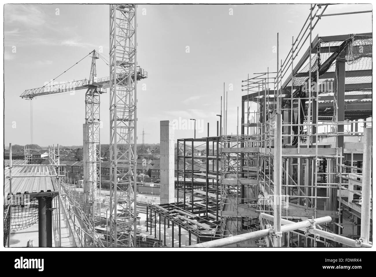 Apri 2015 - Dorchester, England: A construction site with concrete slabs built, steel framing and scaffolding Stock Photo
