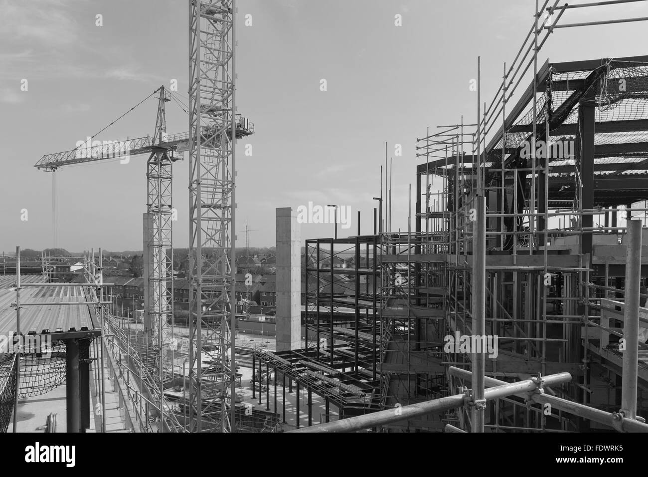 Apri 2015 - Dorchester, England: A construction site with concrete slabs built, steel framing and scaffolding Stock Photo