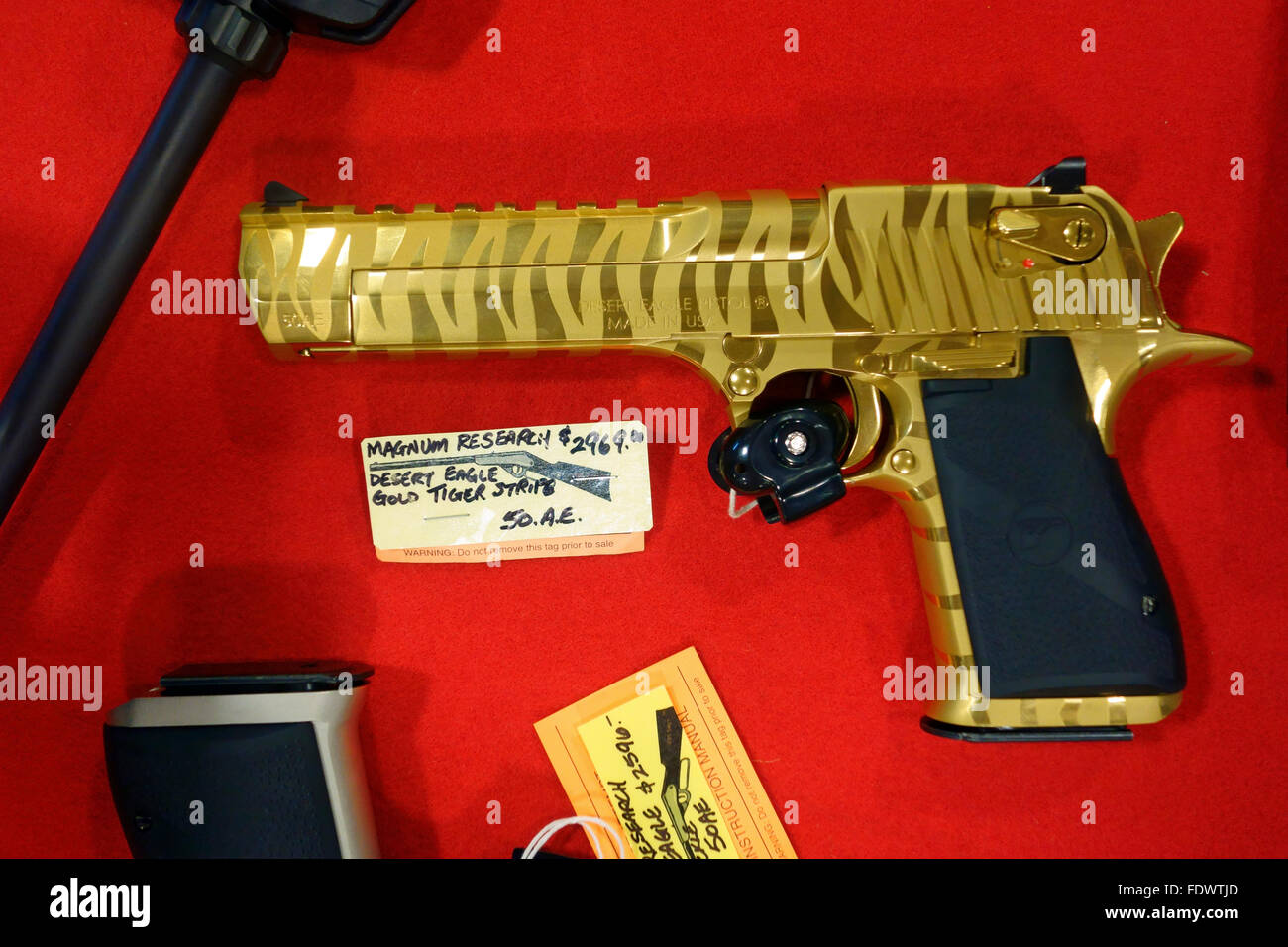 Magnum Research 50 caliber gold Desert Eagle handgun gun pistol weapon Stock Photo
