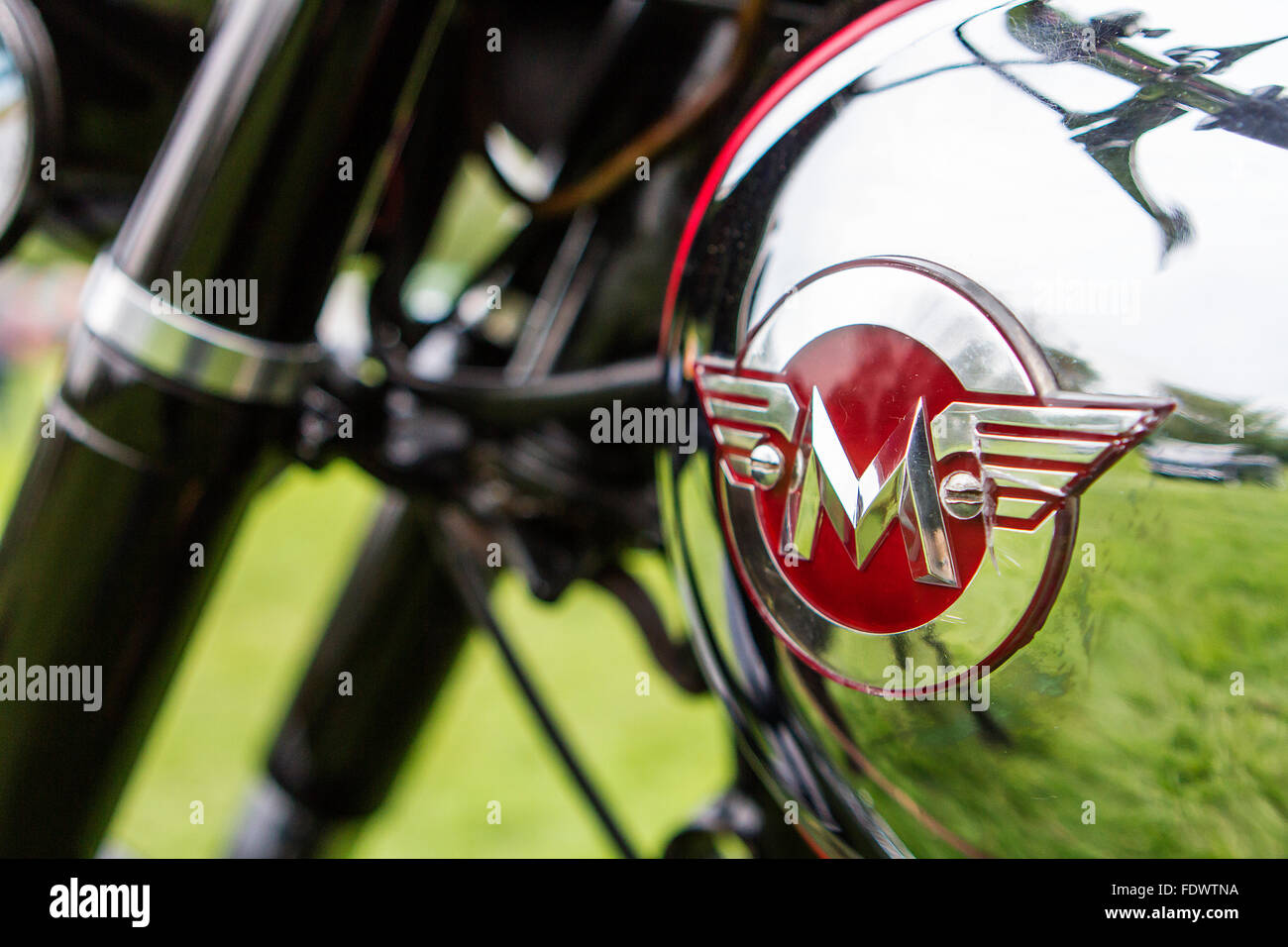 Close up of the winged 'M' on the petrol tank of a Matchless motorcycle at Culcheth Community Day Stock Photo