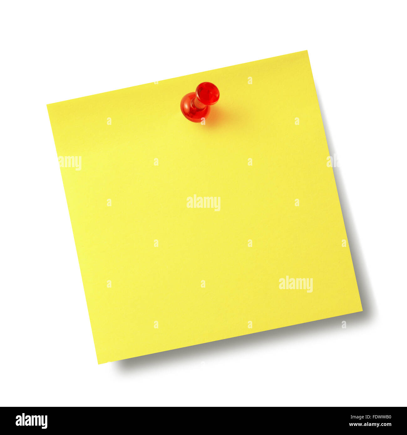 Yellow reminder note with red pin isolated on the white background. Stock Photo