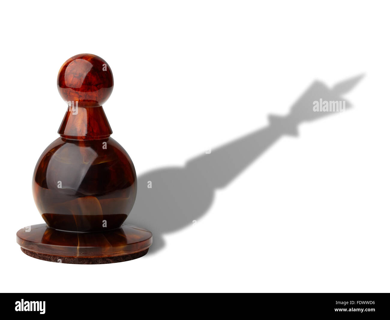Chess pawn with king's shadow isolated on white background, clipping path included. Stock Photo