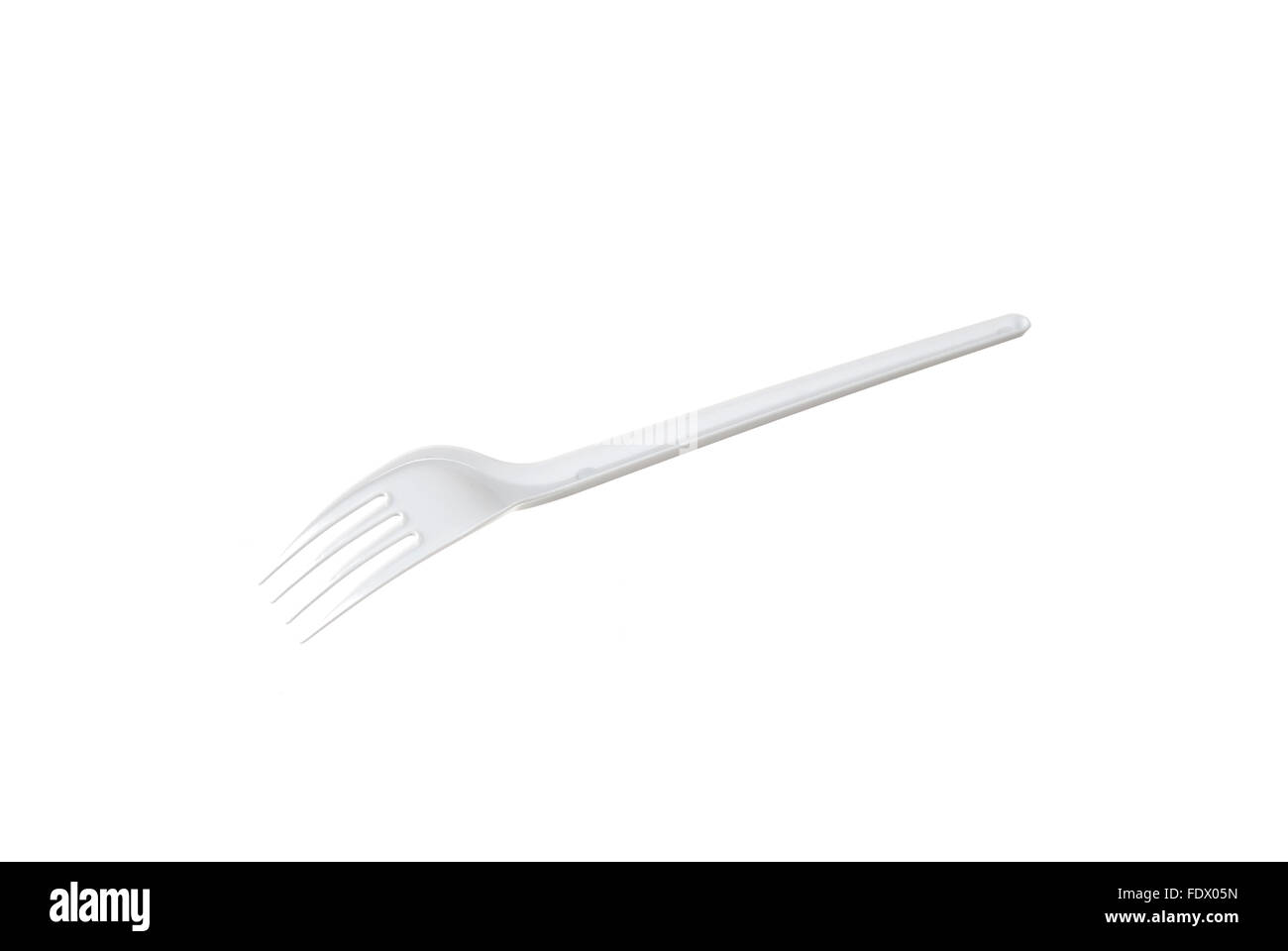 plastic disposable fork is isolated on a white background Stock Photo