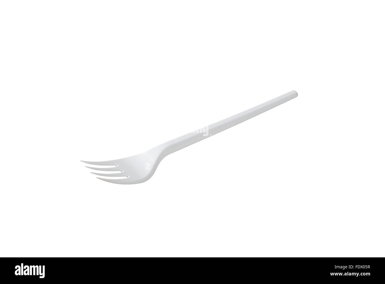 plastic disposable fork is isolated on a white background Stock Photo