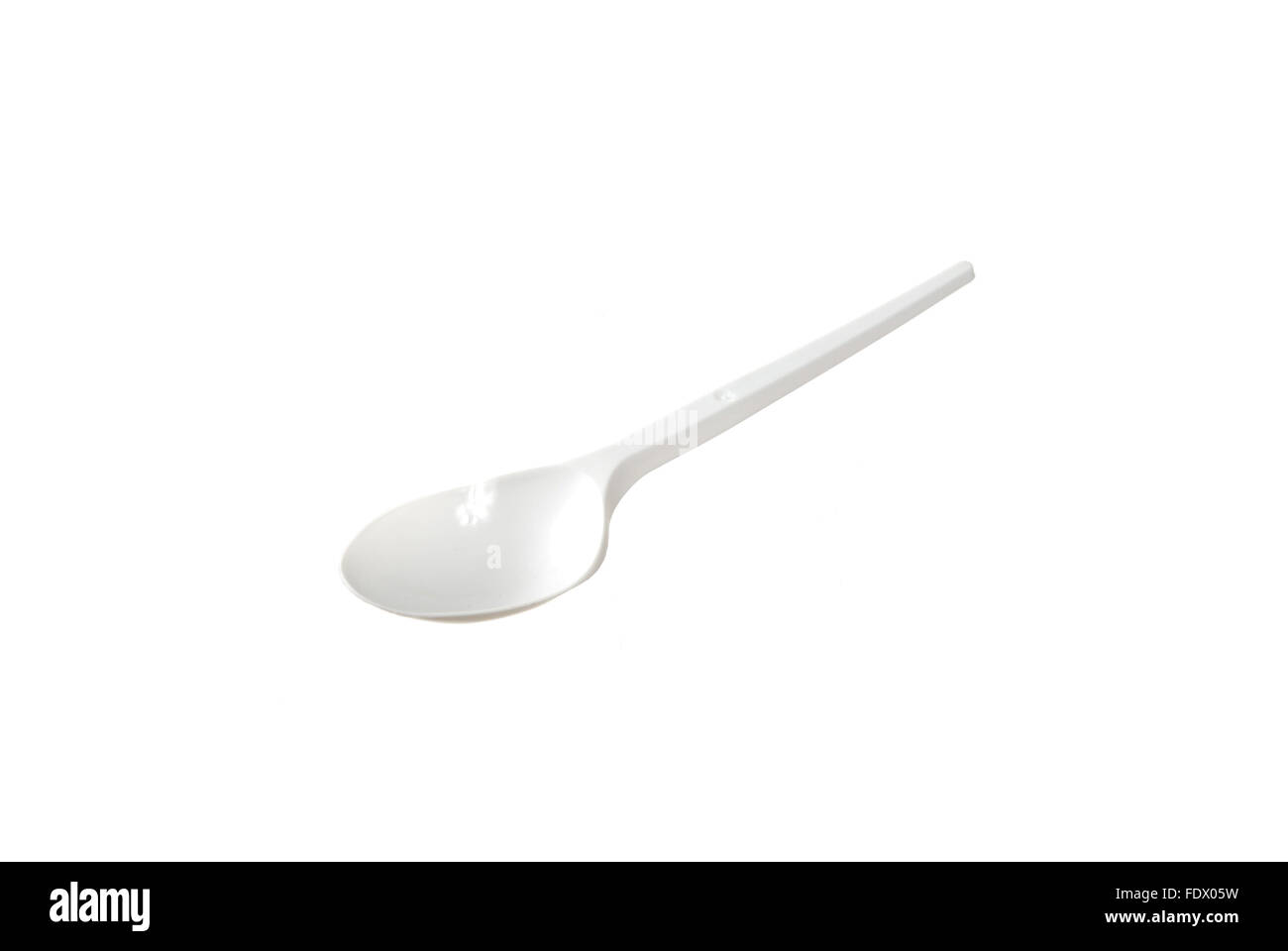 plastic disposable spoon is isolated on a white background Stock Photo