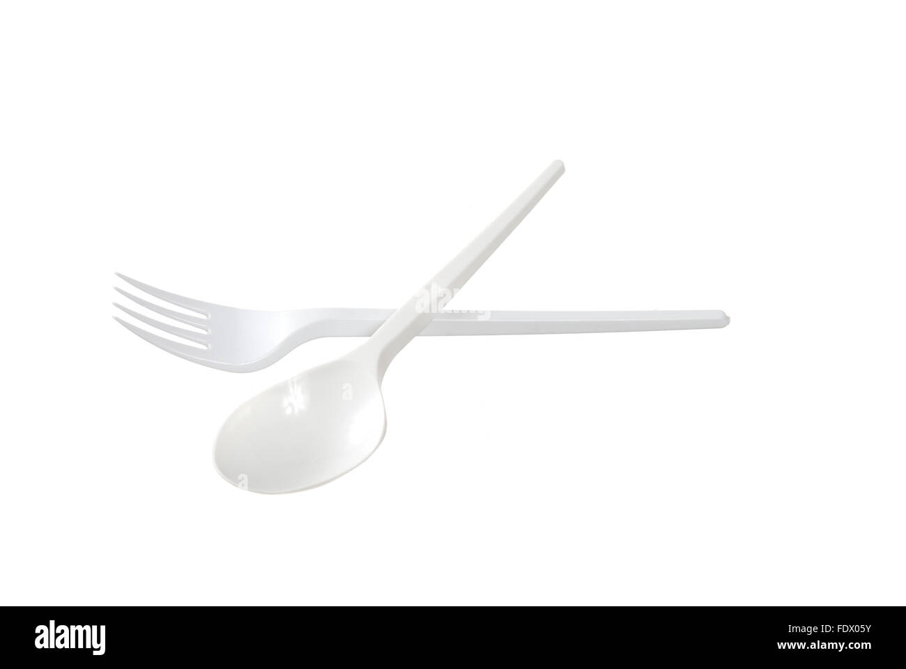 plastic disposable fork and spoon is isolated on a white background Stock Photo