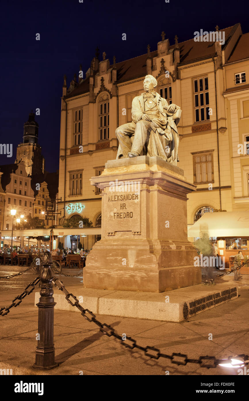 Poland, city of Wroclaw, Aleksander Fredro Monument at night on the Old Town Square Stock Photo