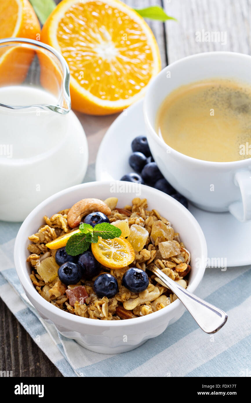 Breakfast set on the table with granola, coffee and yogurt Stock Photo