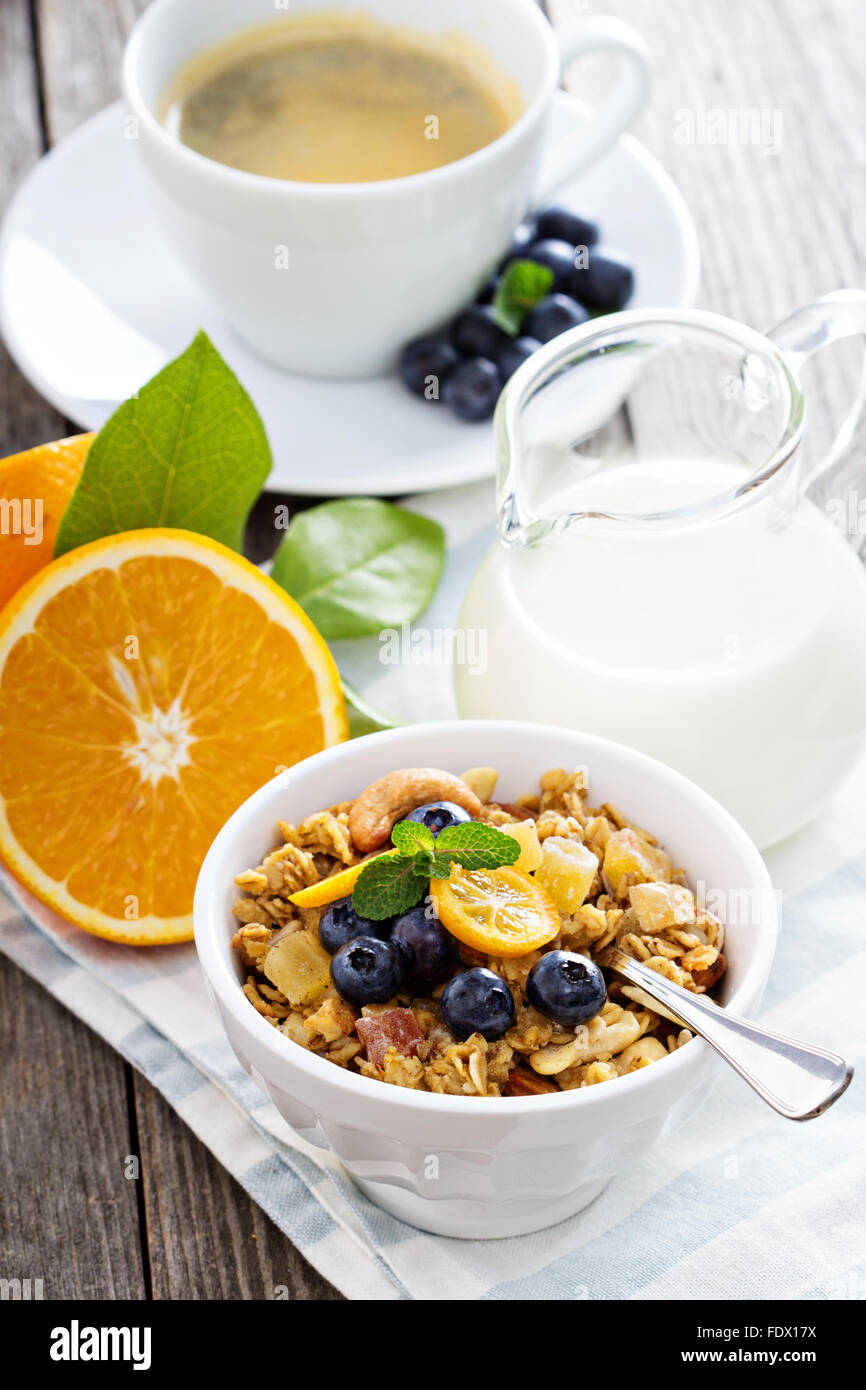 Breakfast set on the table with granola, coffee and yogurt Stock Photo