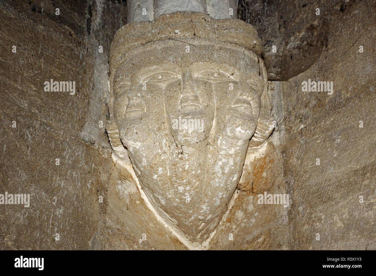 Trifron (three headed personnage) in the Eglise d'Aujac, Charentes. Stock Photo