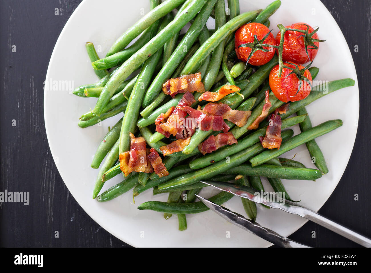 Green beans with bacon and tomatoes top view Stock Photo Alamy