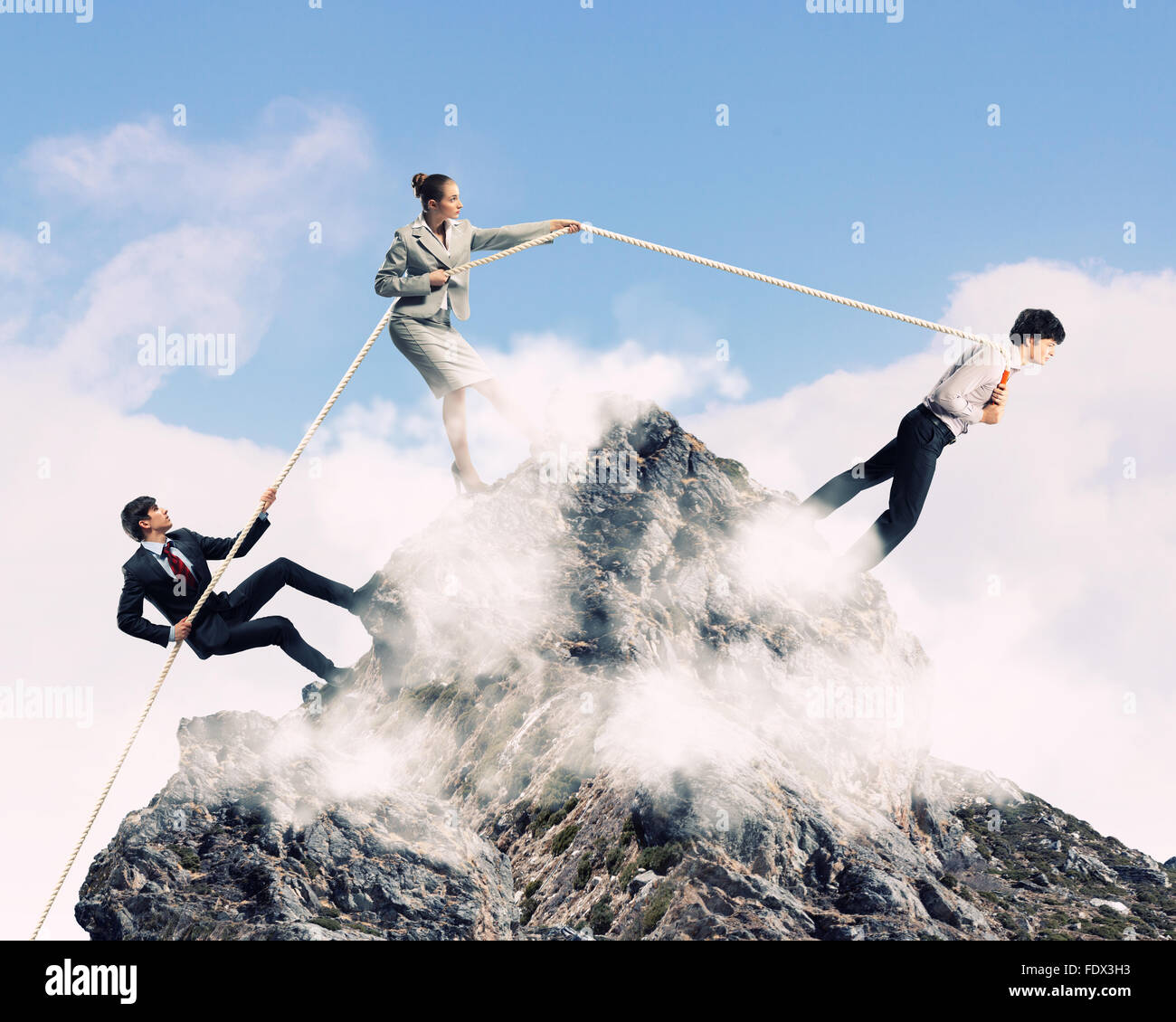 Three business people pulling rope hi-res stock photography and images ...