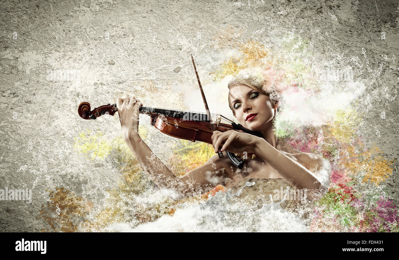 Image of beautiful female violinist playing with closed eyes against colorful background Stock Photo