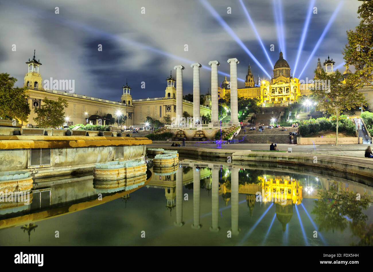 Building of Museum of Catalonia reflecting in water of fountain, Barcelona, Spain Stock Photo