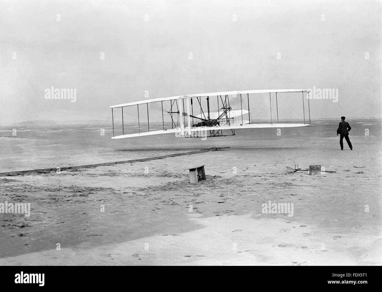 Wright Flyer I. Wright brothers first powered flight in the Wright Flyer at Kill Devil Hills, Kitty Hawk, North Carolina on 17th December 1903. Stock Photo