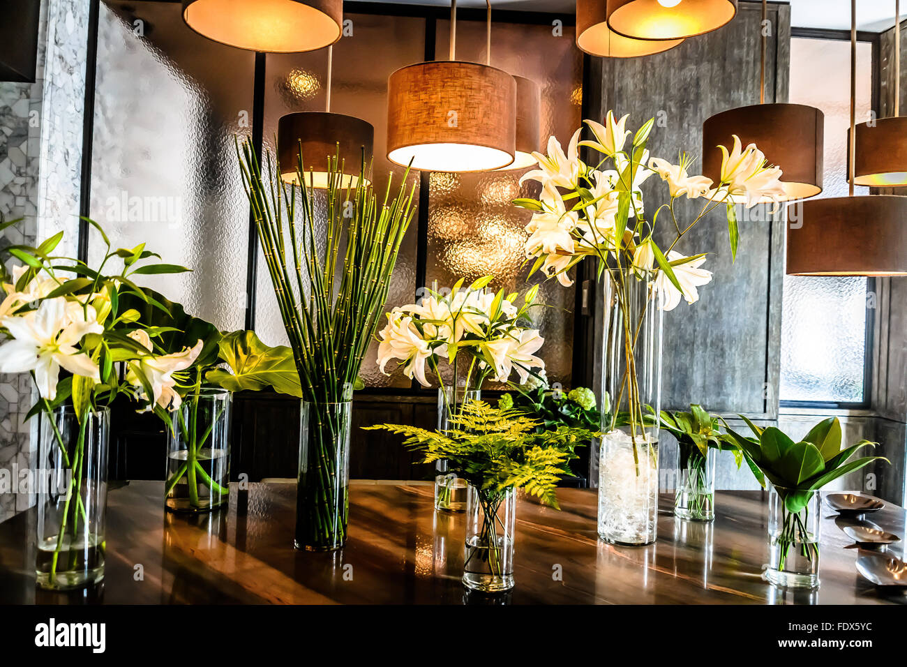 Hanging lights and lilies flower arrangements Stock Photo Alamy