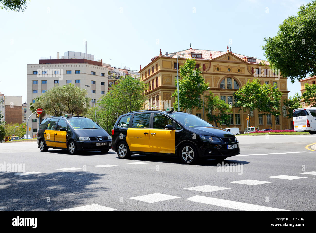 The taxi cars and tourists enjoiying their vacation, Barcelona, Spain Stock Photo