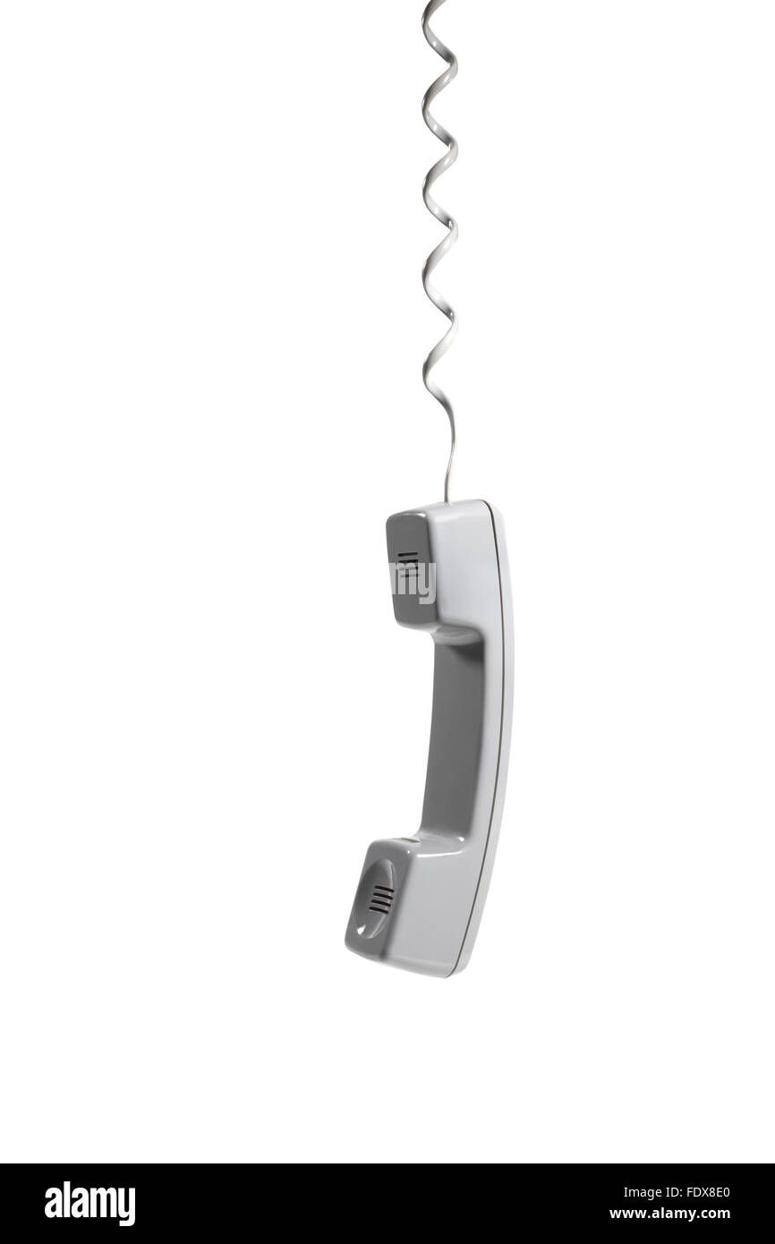 Studio shot of a hanging telephone receiver Stock Photo