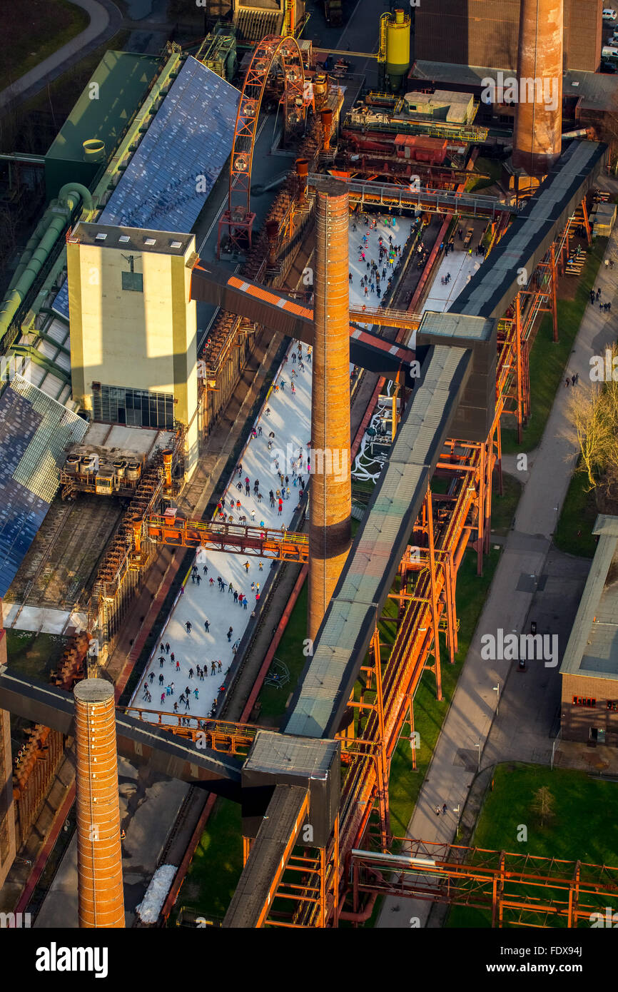 Coking plant, Zeche Zollverein, ice rink, ice skaters, industrial scene, Essen, Ruhr district, North Rhine-Westphalia, Germany Stock Photo