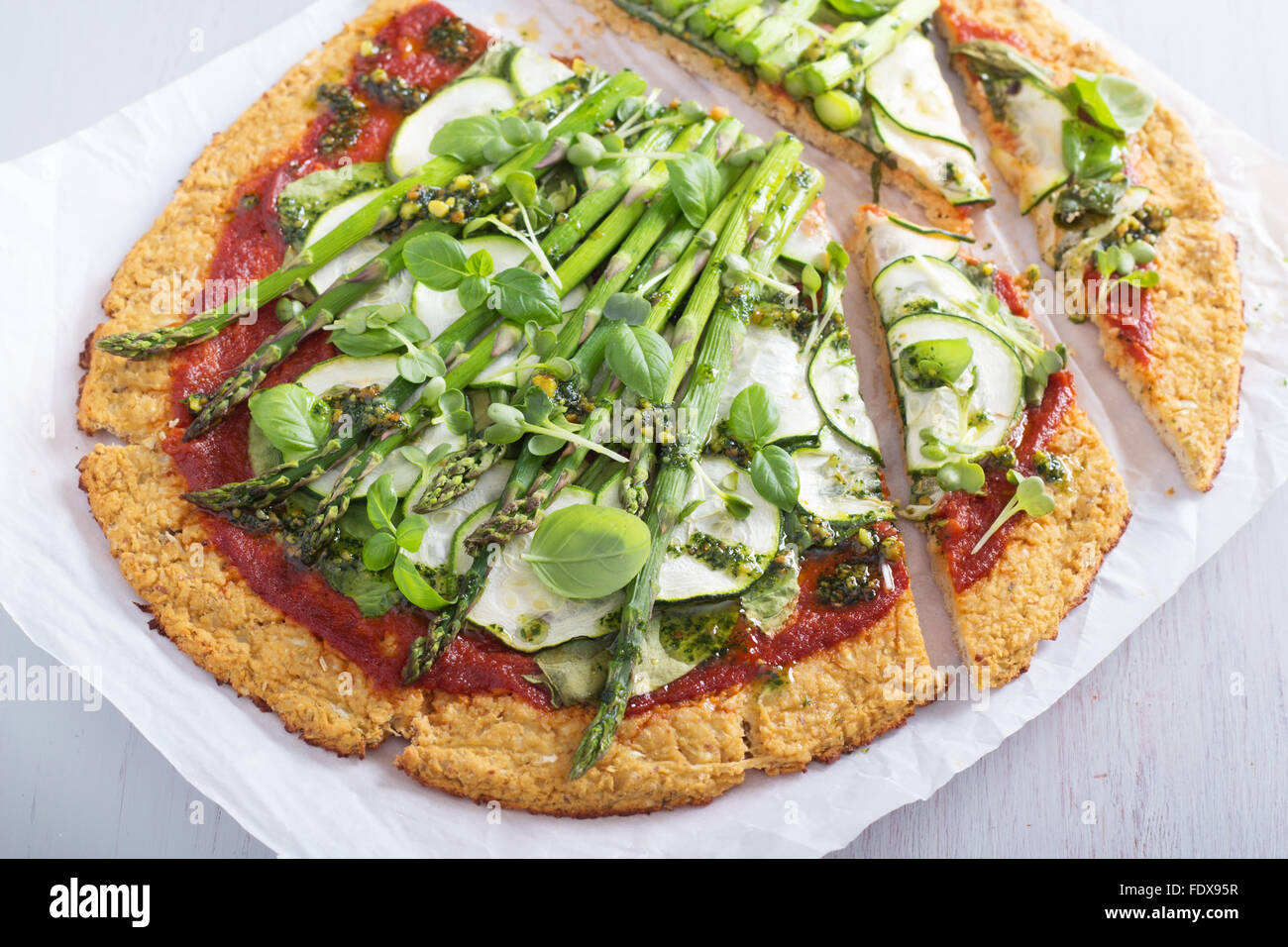 Cauliflower green pizza with spinach, zucchini and asparagus Stock Photo