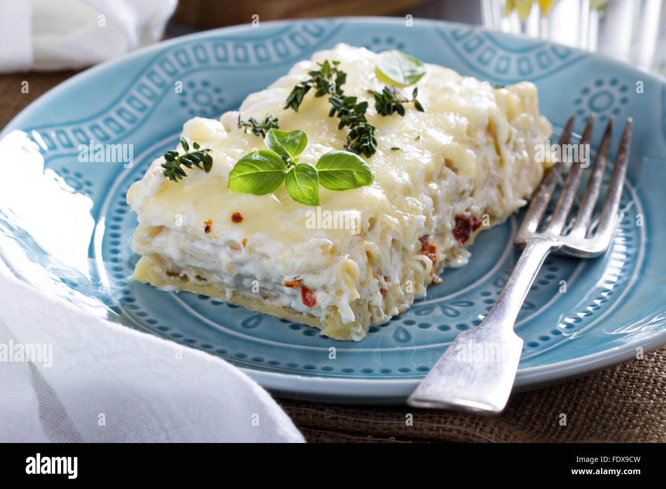 White chicken cheese lasagna with sun dried tomatoes Stock Photo