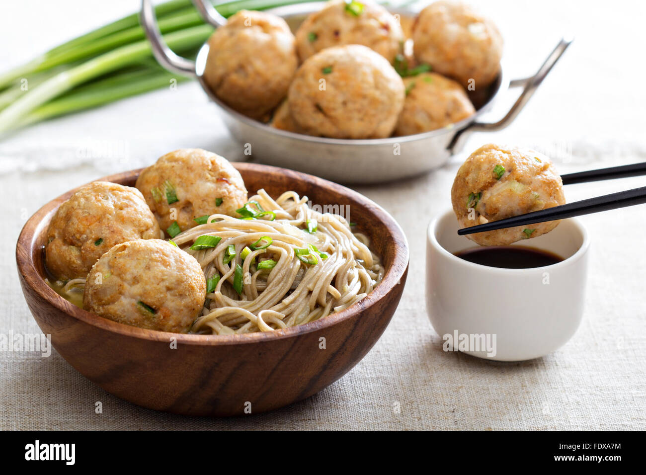 Soba noodles served with ginger chicken meatballs Stock Photo Alamy