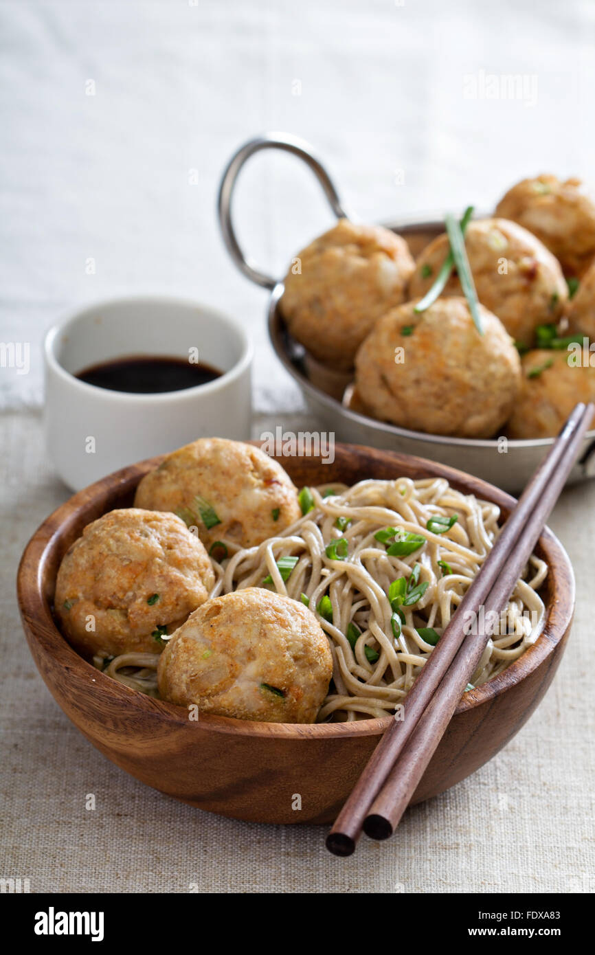 Soba noodles served with ginger chicken meatballs Stock Photo Alamy