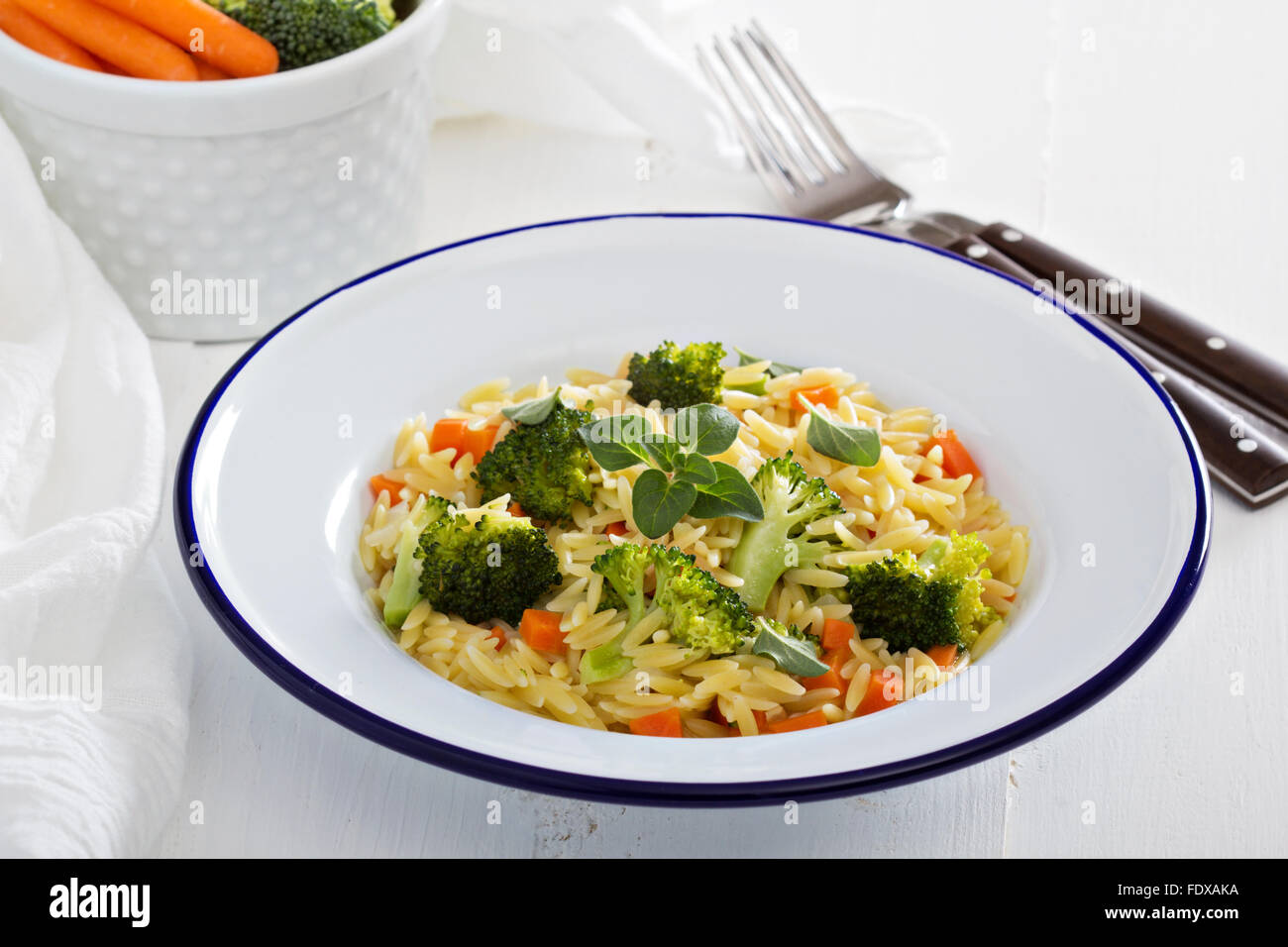 Pasta with broccoli and carrot cooked in stock Stock Photo Alamy
