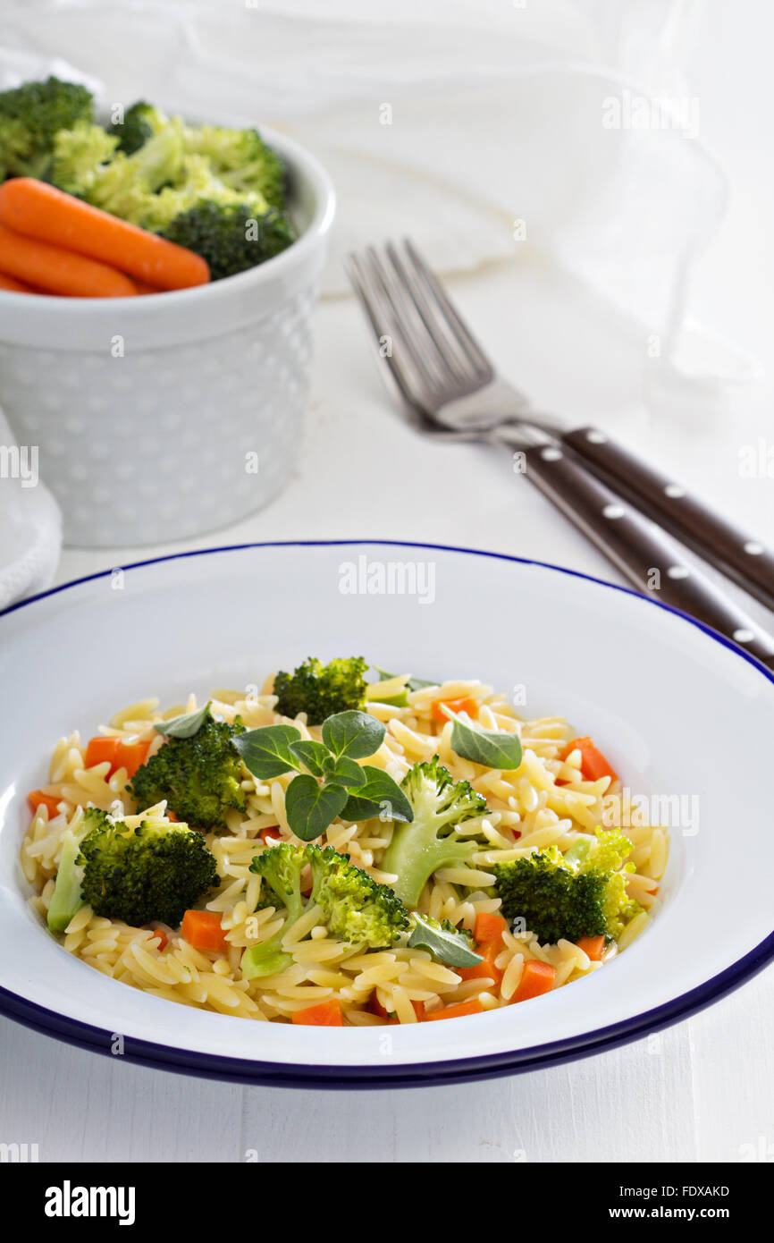 Pasta with broccoli and carrot cooked in stock Stock Photo Alamy