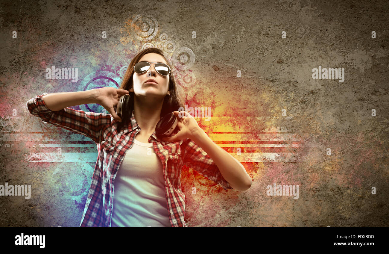 Image of young pretty woman with headphones dancing Stock Photo - Alamy